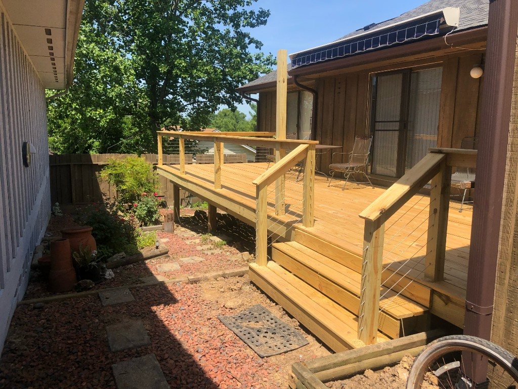 Deck with cable railing against wood siding