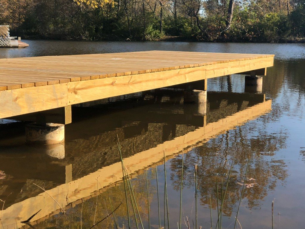Wooden dock on a pond at golden hour