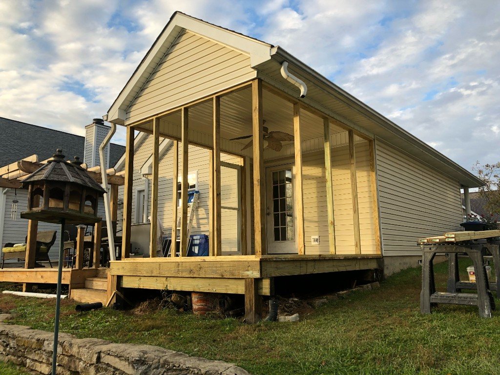 Screened porch addition with timber frame under construction